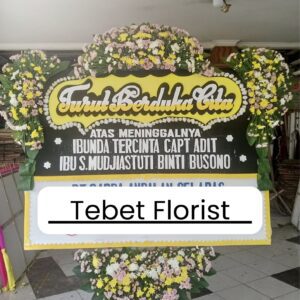 Steek werk duka cita dengan rangkaian bunga kuning