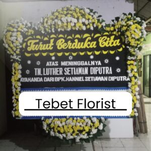 Steek werk duka cita dengan rangkaian bunga kuning